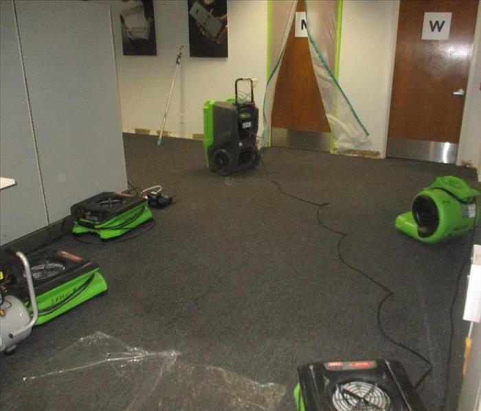 Drying equipment placed to dry carpet.