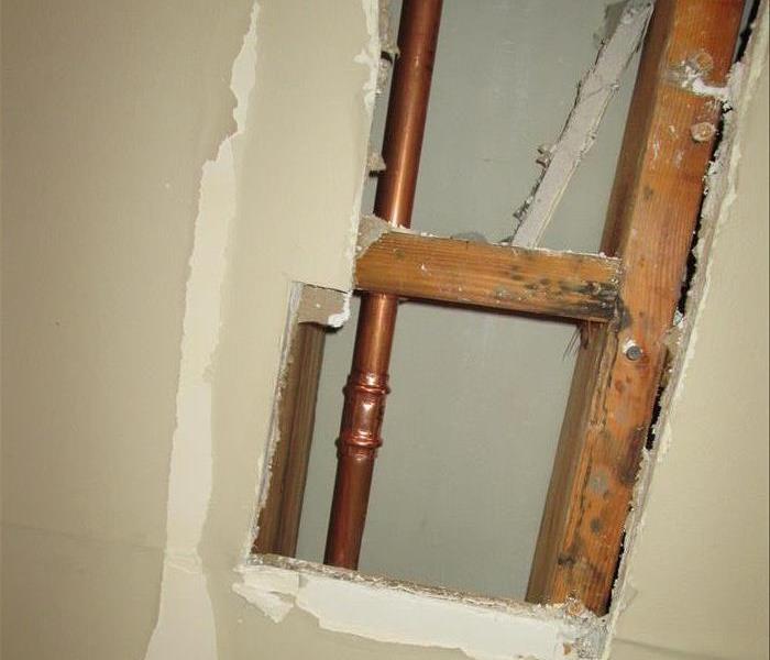 Pipe leak in wall.